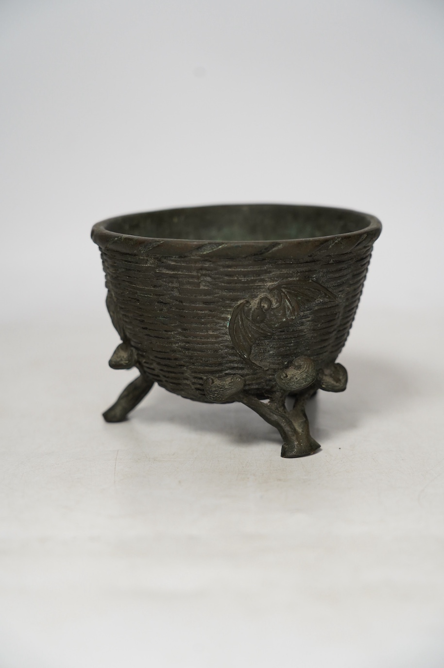 A Japanese bronze tripod censer cast with bats, three character maker’s mark, 12cm in diameter. Condition - fair to good